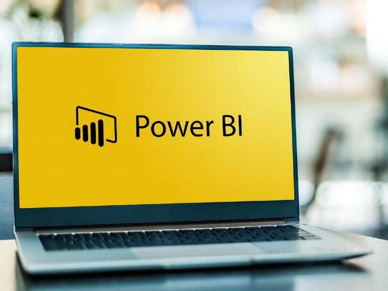 Computadora portátil que muestra el logotipo de Power BI, un servicio de análisis empresarial de Microsoft