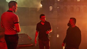 The Russo brothers have a conversation with Chris Evans on the set of Netflix