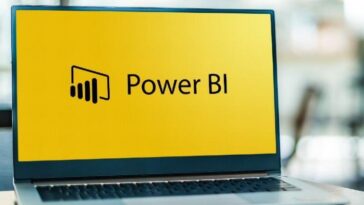 Computadora portátil que muestra el logotipo de Power BI, un servicio de análisis empresarial de Microsoft