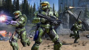 Tres Spartans están en el campo de batalla en Halo Infinite.