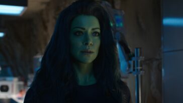 She-Hulk has a concerned expression on her face as she stands in Smart Hulk