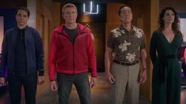 Daniel, William, Chozen, and Amanda stand in a line staring at something off screen in Cobra Kai season 5
