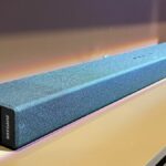 TCL X937U soundbar on TV stand