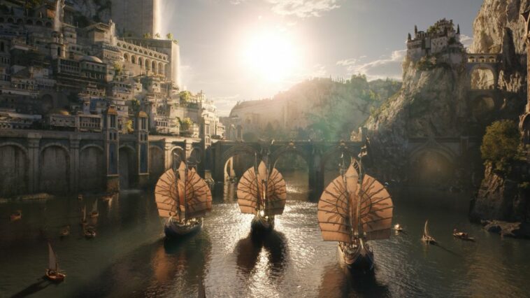 Three Numenorean ships sail into the sun drenched island kingdom of Numenor in The Rings of Power