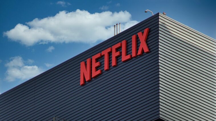 Netlix corporate headquarters building with red logo on outside