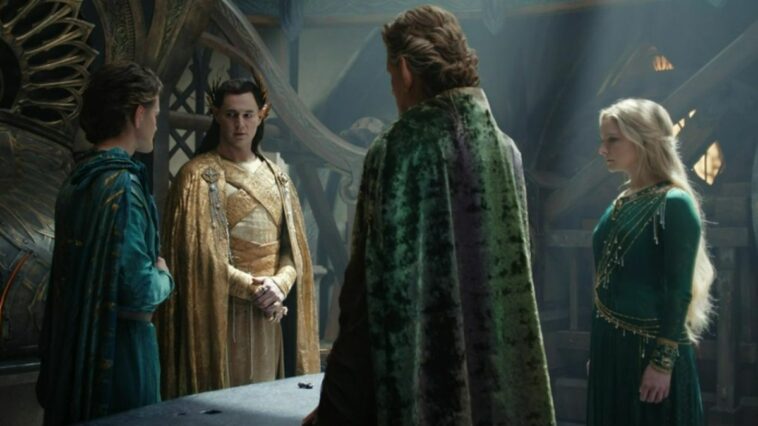 Gil-galad, Elrond, Celebrimbor, and Galadriel stand around a table with the piece of mithril resting on it in The Rings of Power episode 8