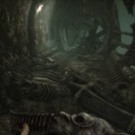 Scorn Review: un pilar se ha derrumbado en el suelo de un túnel.  El detritus está a la altura de la espinilla.  Es imposible cruzar.