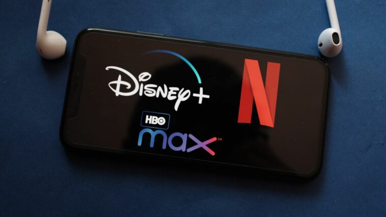 Disney Plus, Netflix and HBO Max logos on an iPhone screen