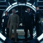 Leo and some other crewmates stand in a vault in Netflix