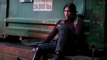 Maya Lopez sits with her back against a forklift truck in Marvel Studios