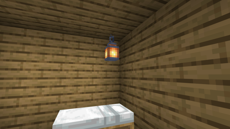 Una linterna y una cama en Minecraft